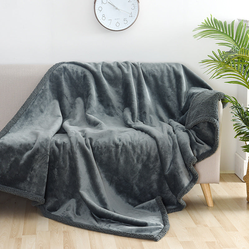 The Fireside Blanket on a sofa
